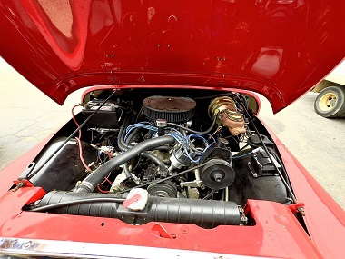 Red Jeep with hood lifted showing engine at Auto Save Tire and Service Center   in Pensacola, FL